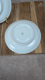 Lot de 2 sous-tasses anciennes en porcelaine de Limoges à décor floral et liseré doré