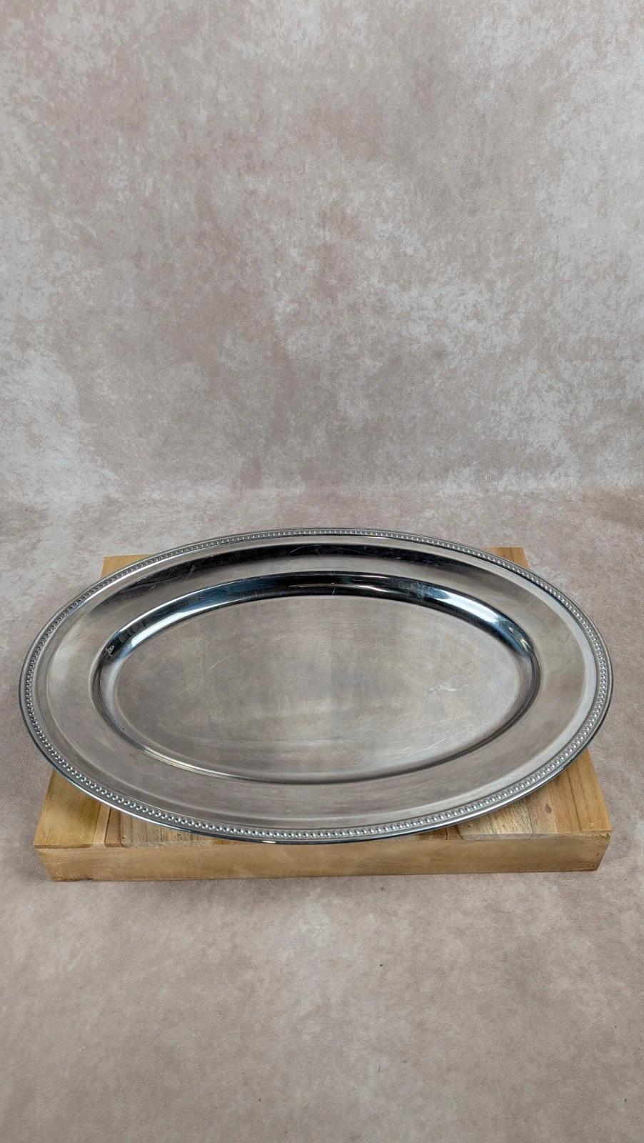 Grand plat ovale en inox vintage