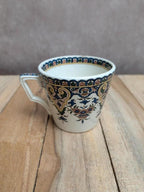 Tasse ancienne en terre de fer Sarreguemines décor polychrome