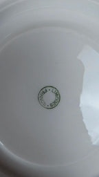 Lot de 2 sous-tasses anciennes en porcelaine de Limoges à décor floral et liseré doré