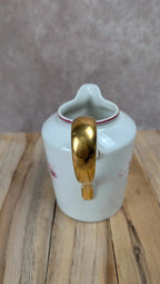 Petit pot à lait en porcelaine de Limoges B&c décor floral rose