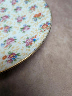 Lot de 9 assiettes à dessert anciennes en porcelaine fleurie