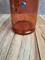 Bouteille ancienne en verre soufflé rose décor floral émaillé à la main