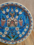 Assiette artisanale en céramique émaillée décor floral oriental