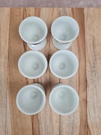 Lot de 6 coquetiers anciens en porcelaine de Paris + support bois