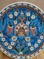 Assiette artisanale en céramique émaillée décor floral oriental