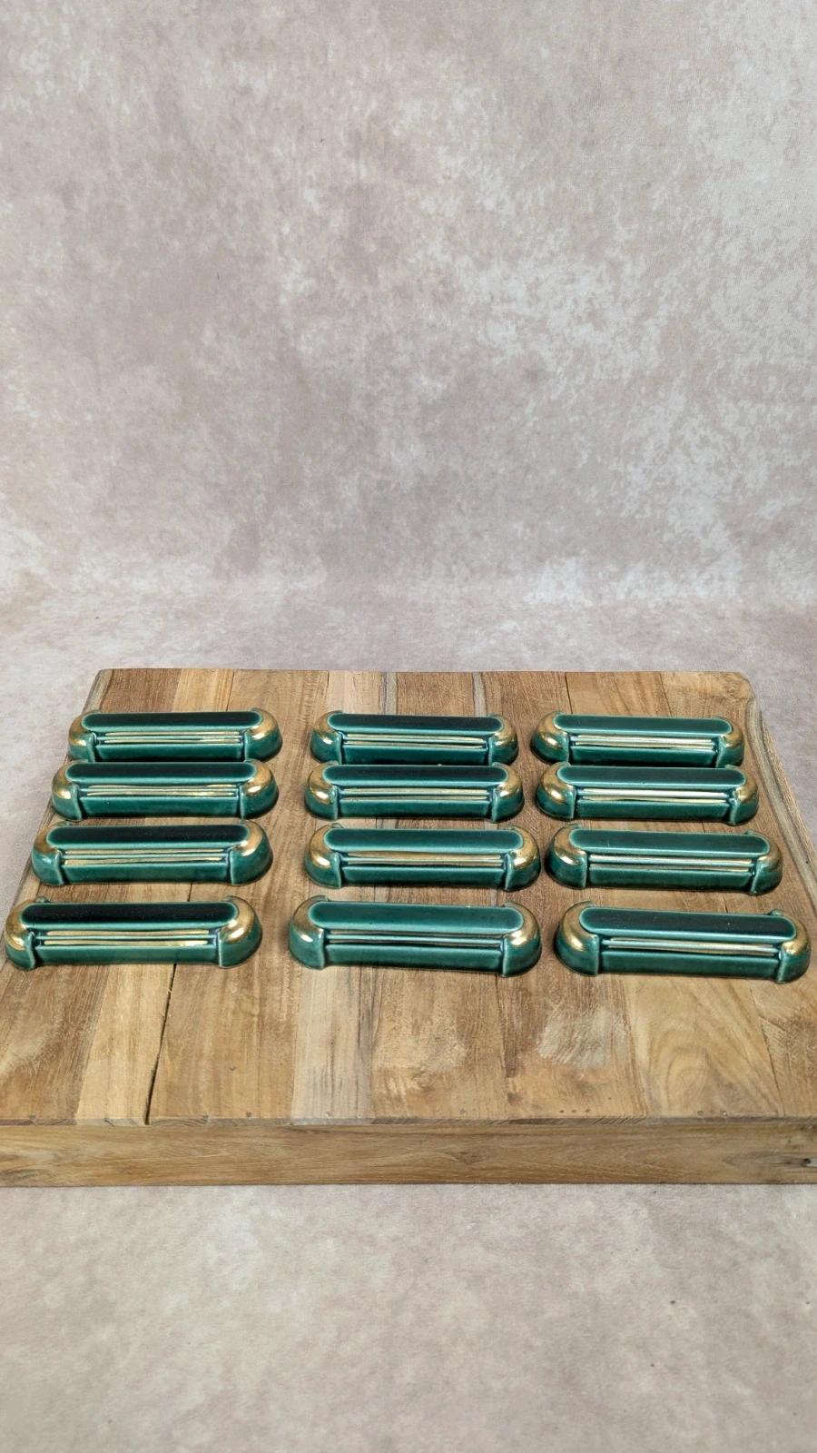 Lot de 12 porte - couteaux Art Déco