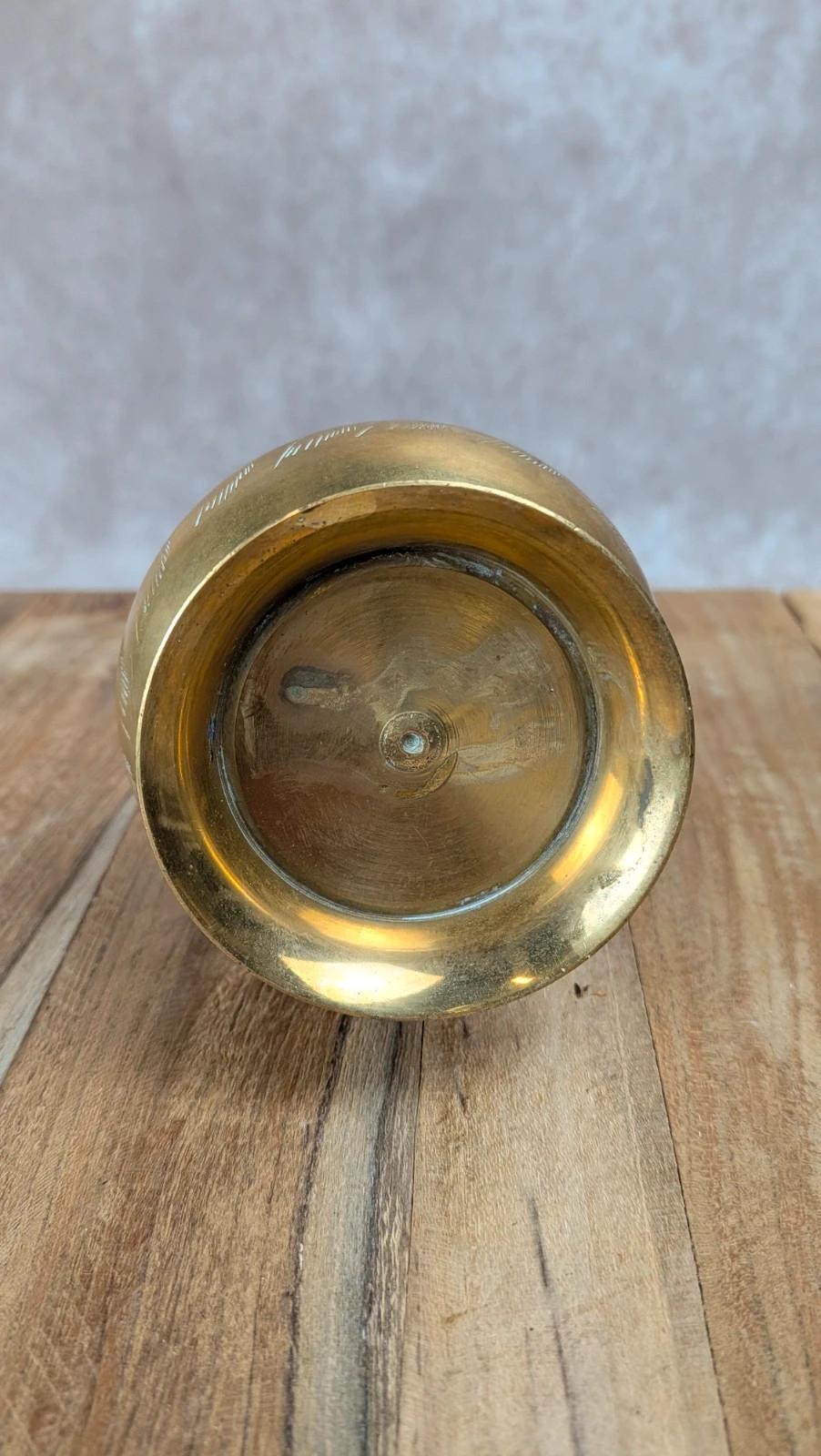 Petit pichet ancien en laiton gravé