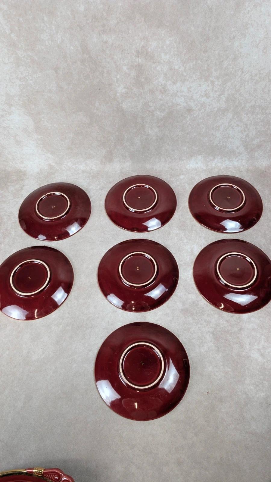 Service à dessert bordeaux et or attribué à Saint - clément