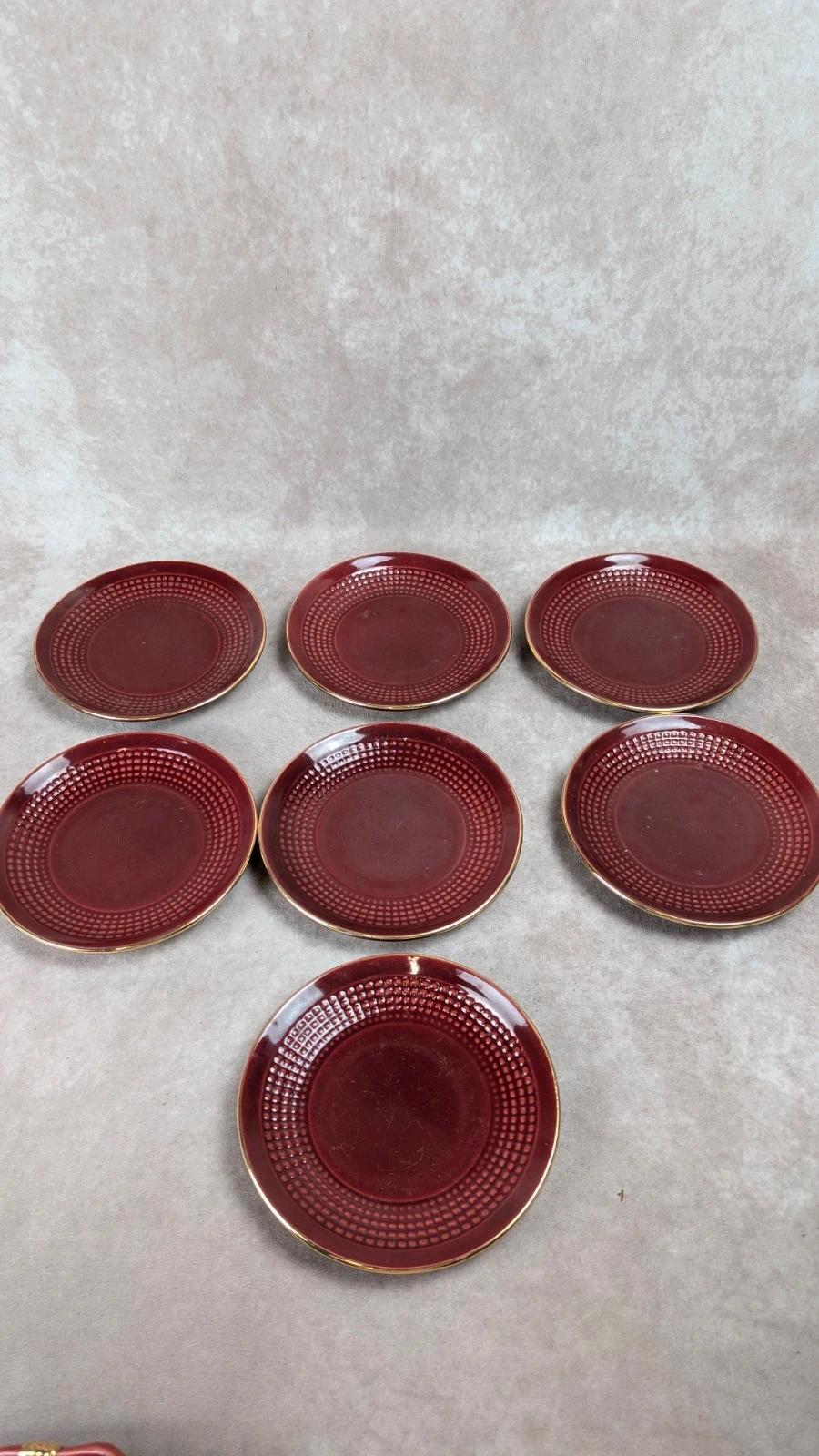 Service à dessert bordeaux et or attribué à Saint - clément