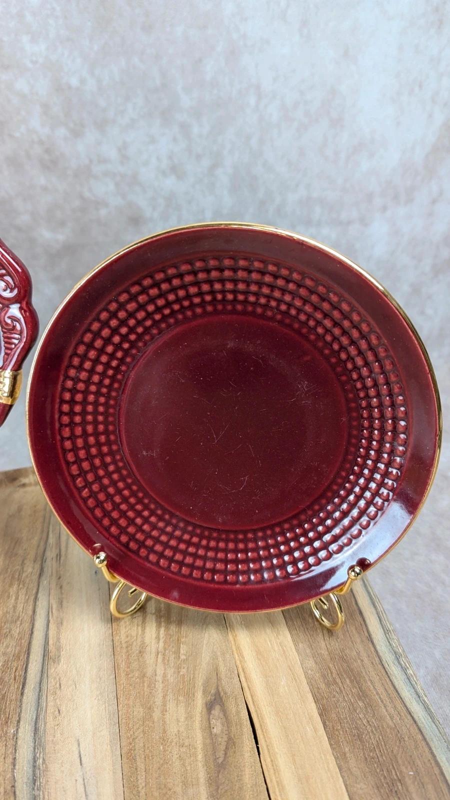 Service à dessert bordeaux et or attribué à Saint - clément