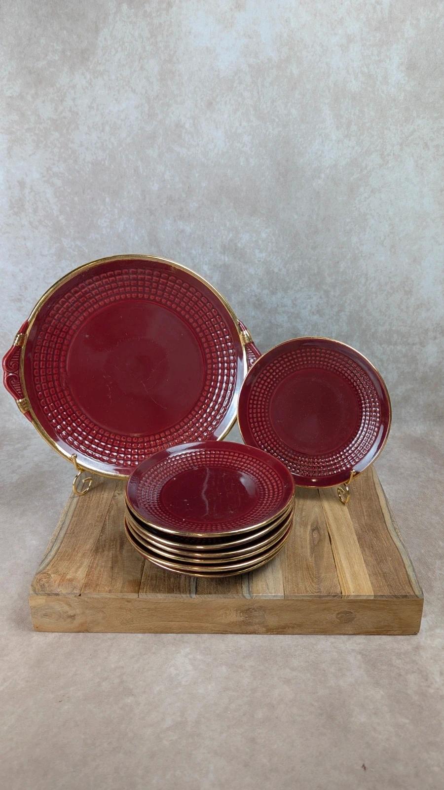 Service à dessert bordeaux et or attribué à Saint - clément