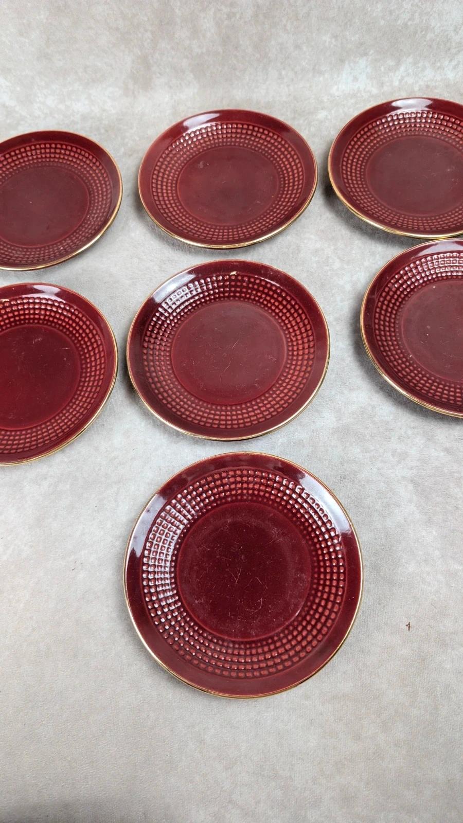 Service à dessert bordeaux et or attribué à Saint - clément