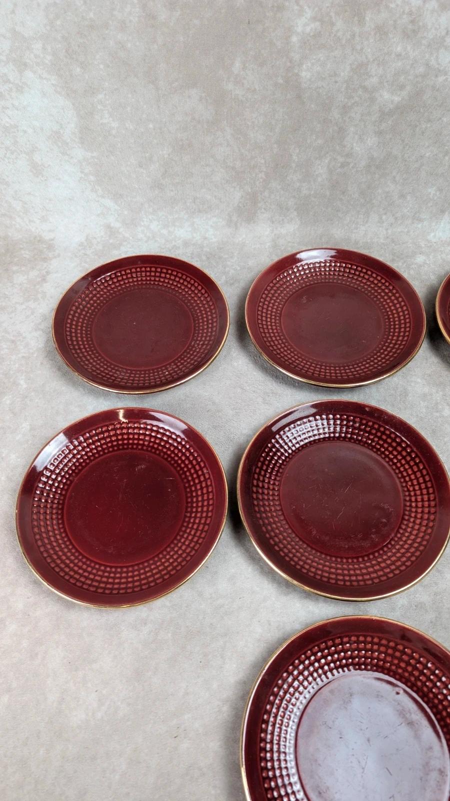 Service à dessert bordeaux et or attribué à Saint - clément